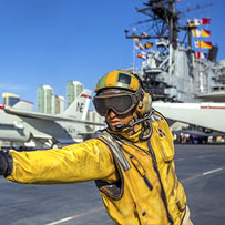 worker on an aircraft carrier